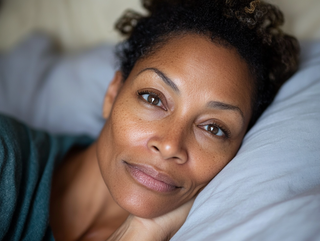 African american woman with fresh face in bed